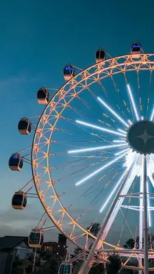 a large ferris wheel in a park at night at The Wheel Bali in Canggu