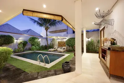a house with a swimming pool in a yard at 6BR Seminyak Oasis with 2 Private Pools in Seminyak