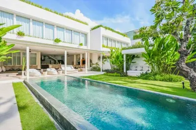 an image of a swimming pool in front of a house at Yelena Spacious 3 BR Private Pool Villa in Canggu