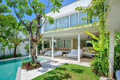 an exterior view of a house with a swimming pool at Yelena Spacious 3 BR Private Pool Villa in Canggu