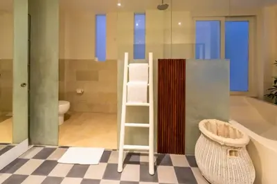 a bathroom with a ladder and a toilet at Yelena Spacious 3 BR Private Pool Villa in Canggu