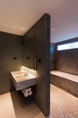 a bathroom with a sink and a bath tub at 2 Bedroom Seminyak Apartment -1 in Seminyak