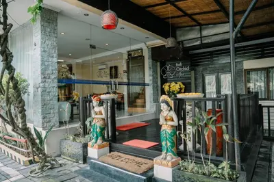 a store front with two statues in front of it at Bali Orchid Spa in Kuta