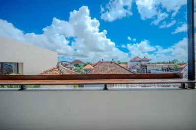 a view of a city from a balcony at Wana Kubu Suite and Dormitory in Ngurah Rai International Airport