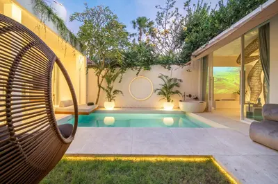a swimming pool in the backyard of a house at Magic Day 2BR Private Sauna, Jacuzzi, Projector in Seminyak