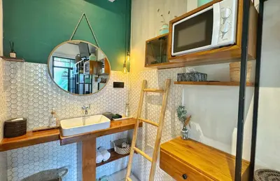 a bathroom with a sink and a mirror at Private Room, 2 Minutes walk to KuDeTa Beach Seminyak in Seminyak
