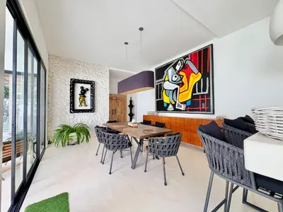 a dining room with a table and chairs at Casa Bali in Kerobokan