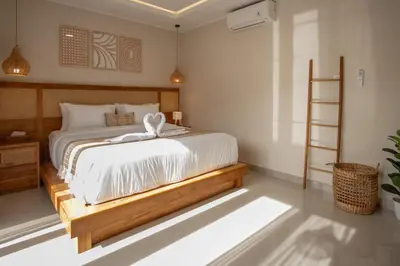 a bedroom with a large bed with a wooden frame at A Better Villa 3BR Seminyak 5min Beach Bintang in Seminyak