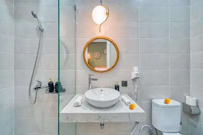 a bathroom with a sink and a shower at Affordable 2 Bedroom Villa in Kerobokan with Private Pool in Kerobokan