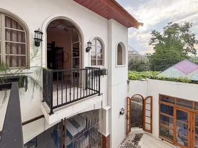 an external view of a house with a balcony at The Lavana Villa Bungas near Nusa Dua in Jimbaran