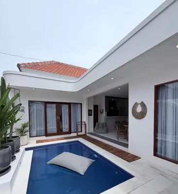 a villa with a swimming pool in the backyard at Villa Amore in Canggu