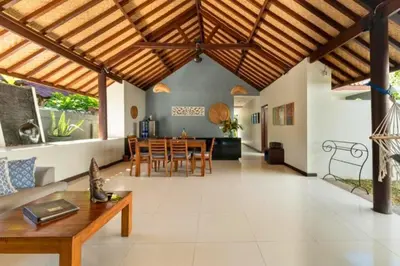 a large living room with a wooden ceiling at Indira Peaceful 1 BR Private Pool Villa in Seminyak