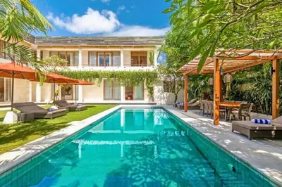 a swimming pool in the backyard of a house at Kalyca Stunning 5 BR Private Pool Villa in Jimbaran
