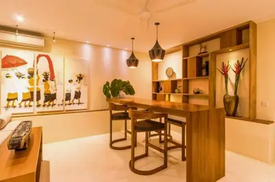 a home office with a desk and a table at Kalyca Stunning 5 BR Private Pool Villa in Jimbaran