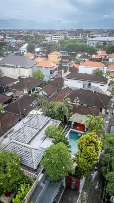 an overhead view of a city with buildings and trees at Villa Melbourne in Seminyak