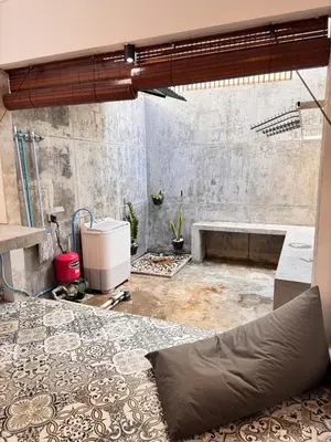 a bathroom with a bath tub in a room at Cozy Minimalist Home Near Seminyak & Kuta in Seminyak