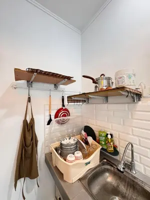 a kitchen with a sink and a counter with dishes at Cozy Minimalist Home Near Seminyak & Kuta in Seminyak