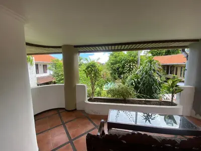 a view of a living room with a large window at arjuna house in Seminyak