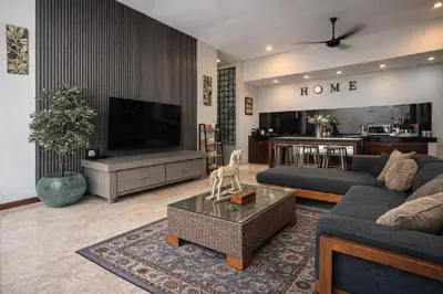 a living room with a couch and a tv at Jalina Private Villa in Central Seminyak in Seminyak