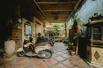 a group of scooters parked in a room at Samblung Mas House in Denpasar