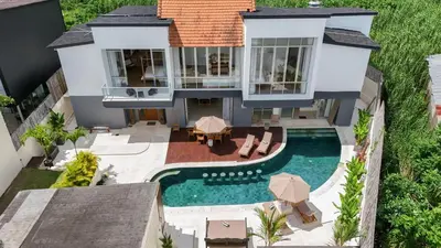 an aerial view of a house with a swimming pool at Villa Turkuaz in Seminyak