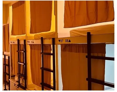 a group of bunk beds in a room at Mycapsule Bali in Seminyak