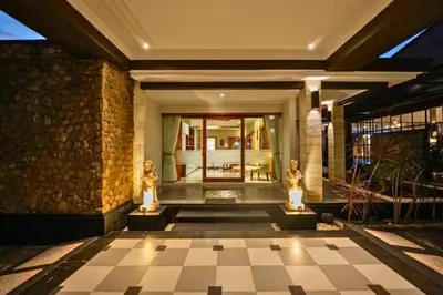 a lobby of a building with two statues on the floor at Ghania Peaceful 3 BR Private Pool Villa in Jimbaran