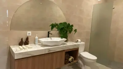 a bathroom with a sink and a toilet at Narayuka private villa in Seminyak