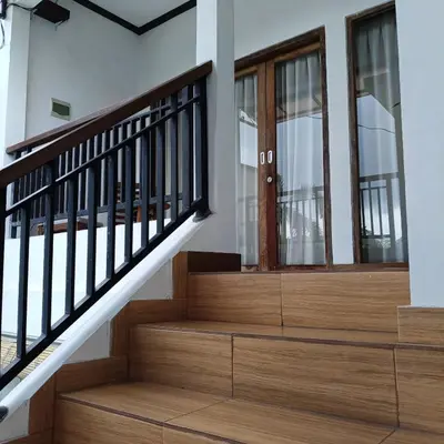 a staircase in a house with wooden treads at Villa Sammy in Seminyak