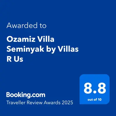 a screenshot of a cell phone with the text awarded to oamina villa at Villa Ozamiz Seminyak in Seminyak