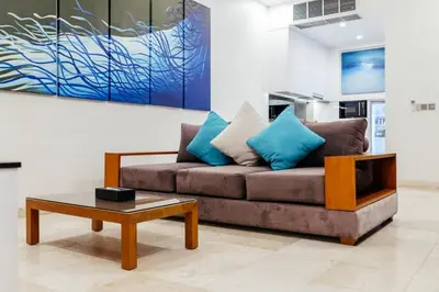 a living room with a couch and a coffee table at Kamil Villas in Seminyak