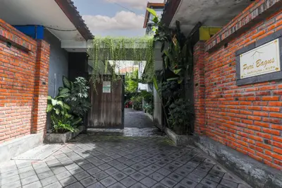 an alley with a door and a brick building at Puri Bagus Villa by Great Bali Villas in Legian