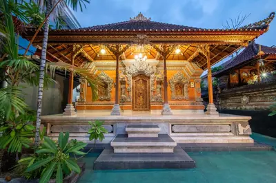 a temple in a building with a fountain at The Kutaya in Kuta