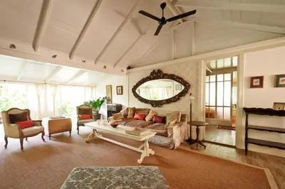 a living room with a couch and a table at The Island Houses Seminyak in Seminyak