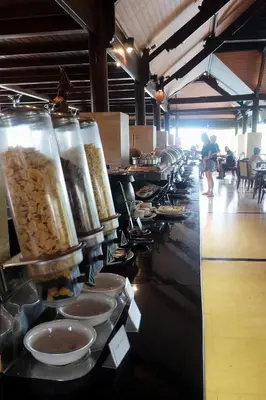 a buffet line of food in a restaurant at Grand Balisani Suites Hotel in Seminyak
