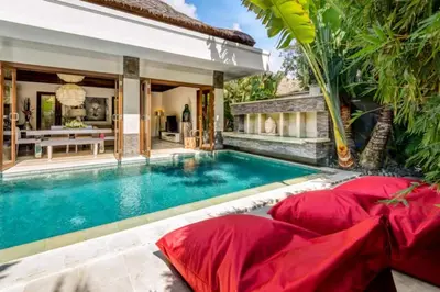 a pool in the backyard of a villa at The Residence Seminyak in Seminyak