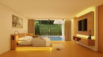 a bedroom with a bed and a flat screen tv at Bvilla Spa in Seminyak
