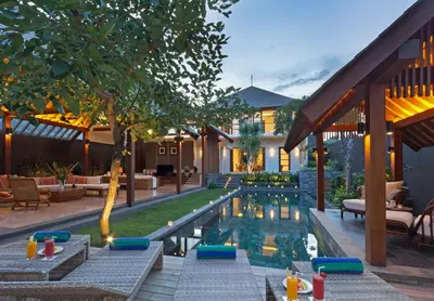 a pool in the backyard of a house at Villa Meliya in Canggu