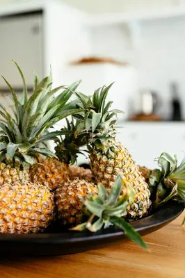 a plate of pineapples sitting on a table at Villa Soleh in Seminyak