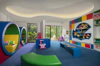 a childs play room with colorful furniture at Golden Tulip Jineng Resort Bali in Kuta