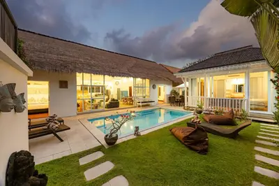 a house with a swimming pool in the yard at Villa Blue Pearl by Optimum Bali Villas in Seminyak