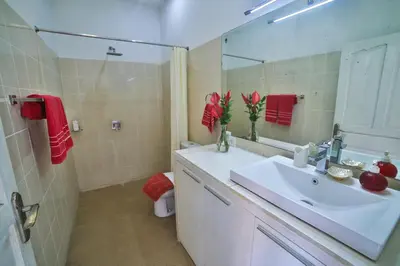 a bathroom with a sink and a mirror at Bali Cinta Villa in Seminyak