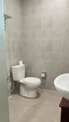a bathroom with a toilet and a sink at Baliana Villa Legian in Legian