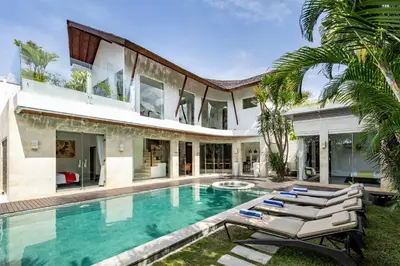 an exterior view of a house with a swimming pool at Villa Belle Seminyak by Exotic Bali Properties in Seminyak