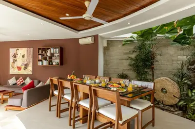 a dining room with a table and chairs at Villa Belle Seminyak by Exotic Bali Properties in Seminyak