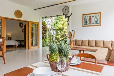 a living room with a table with a pineapple on it at Adorable 1BR villas in the heart of Seminyak in Seminyak