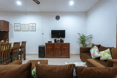 a living room with couches and a flat screen tv at Villa Sedana, Seminyak - 2 Bedroom Private Pool Villa! in Seminyak