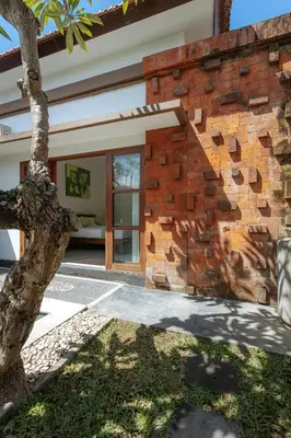 a brick wall of a building with a window at Villa Sedana, Seminyak - 2 Bedroom Private Pool Villa! in Seminyak