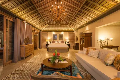 a living room with a couch and a bed at Jadine Bali Villa by Nagisa Bali in Canggu