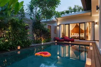 a swimming pool in the backyard of a villa at Villa Sally in Canggu